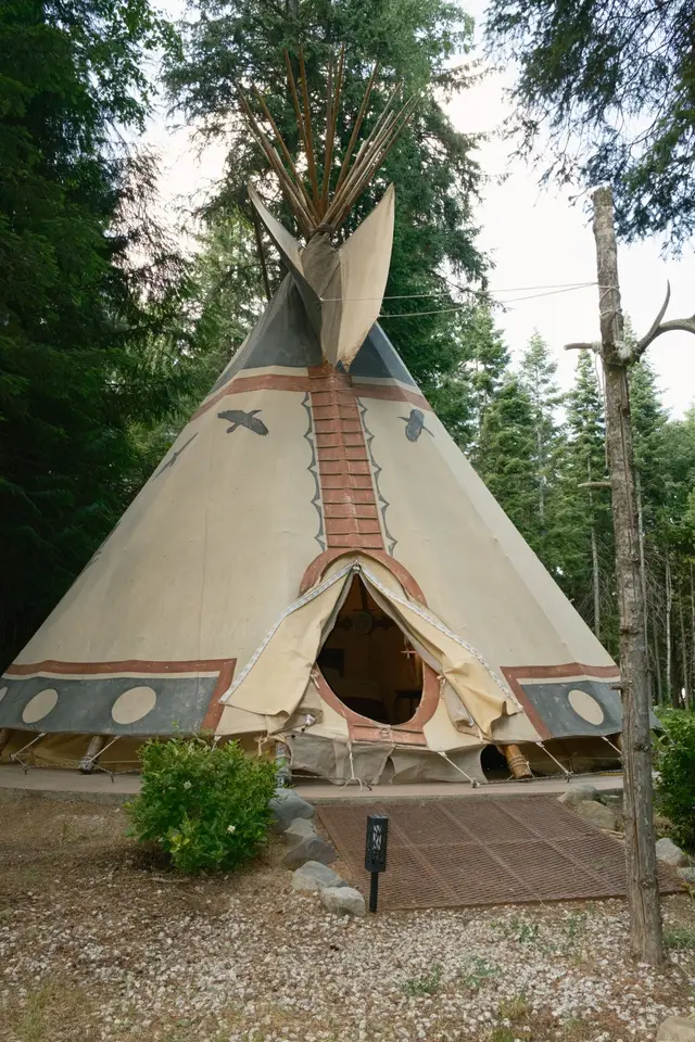 Tipi entrance with hand-painted details at Woodland Tipi, Sandpoint Idaho