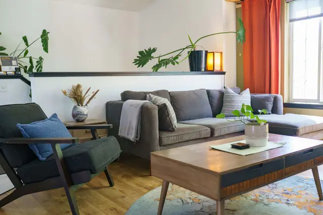 Couch and Chair in living room upstairs with cozy blankets, pillows and decor at Garden House, Coeur d'Alene Idaho