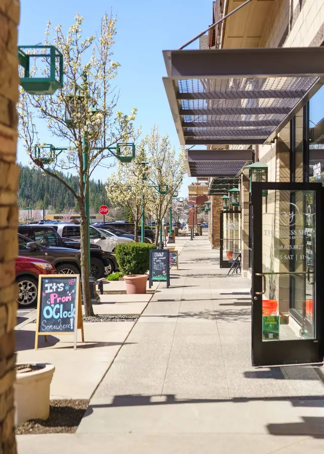 Explore Riverstone's tree-lined sidewalks and inviting storefronts at Riverstone Village Retreat, Coeur d'Alene Idaho