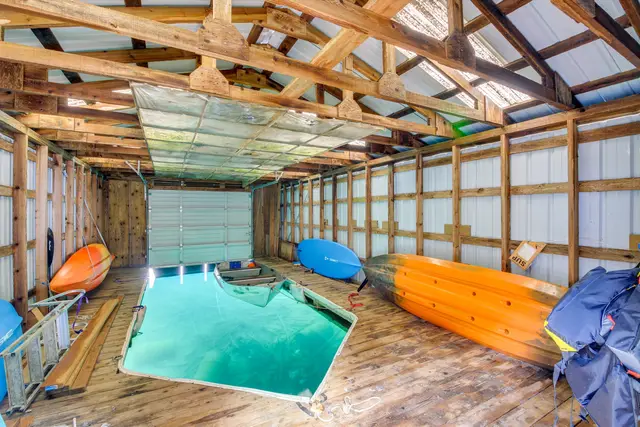 Boat house with two paddle boards provided & space to park your boat at Bay-View Cabin, Bayview Idaho
