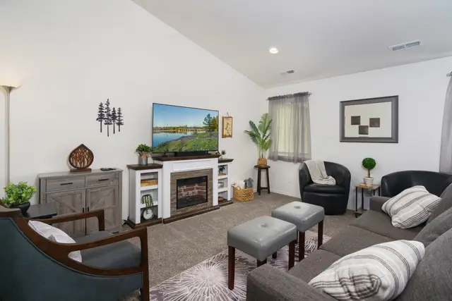 Gather the whole family in this cozy living room—sink into the plush sectional under soft at Pine and Vine Cottage, Rathdrum Idaho